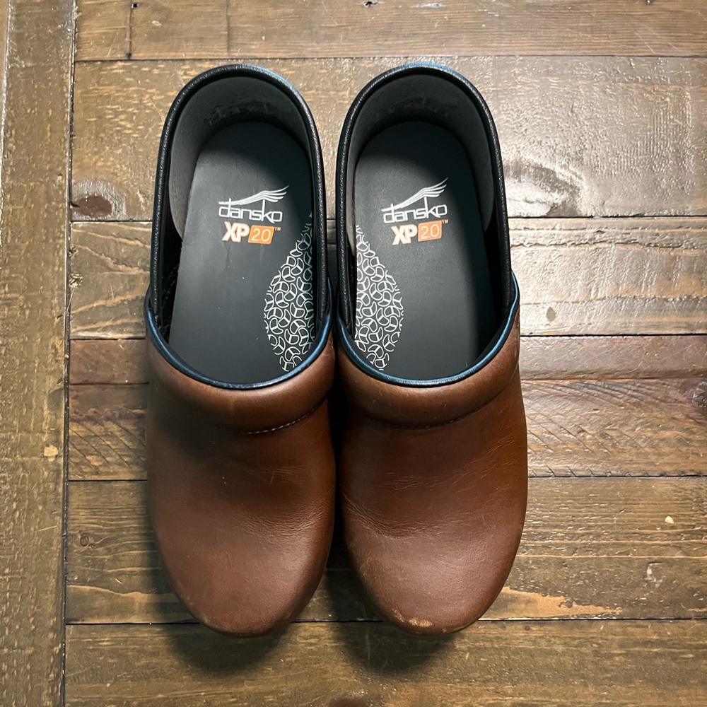 Dansko XP women’s Brown Clogs worn 2x. Mild wear.